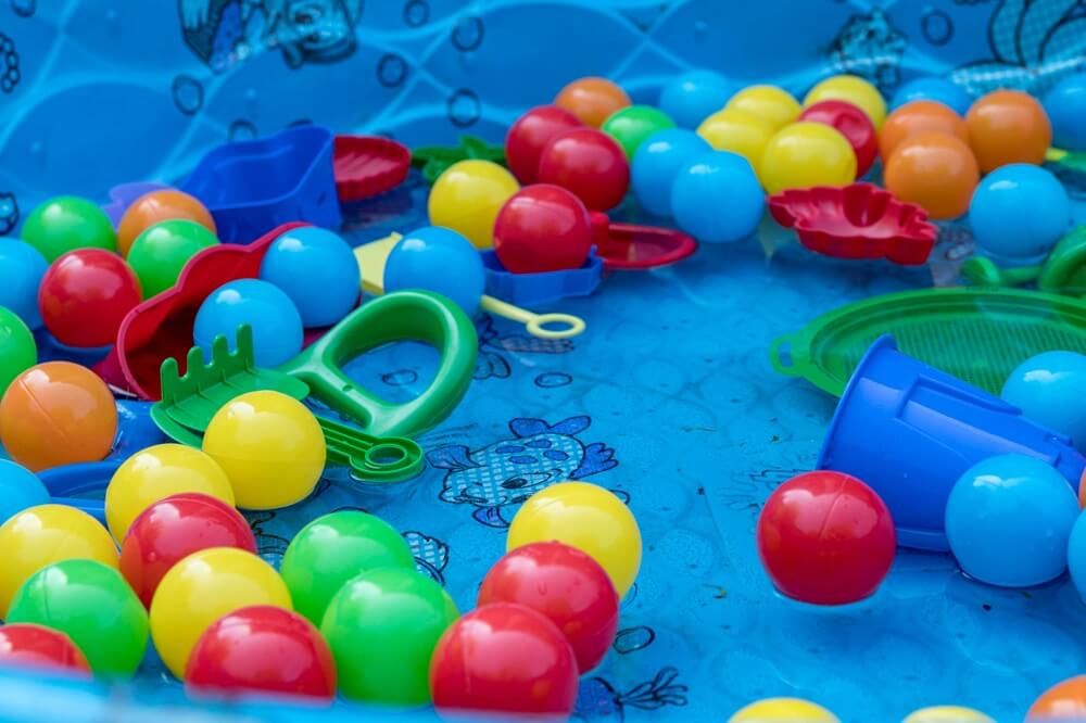 colorful plastic toys in an above ground pool