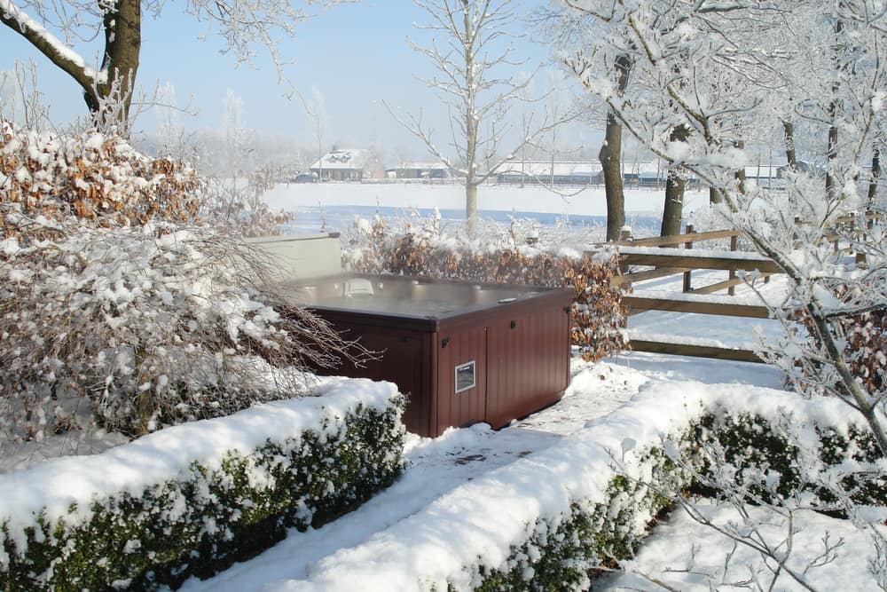 sundance hot tub with cover in winter