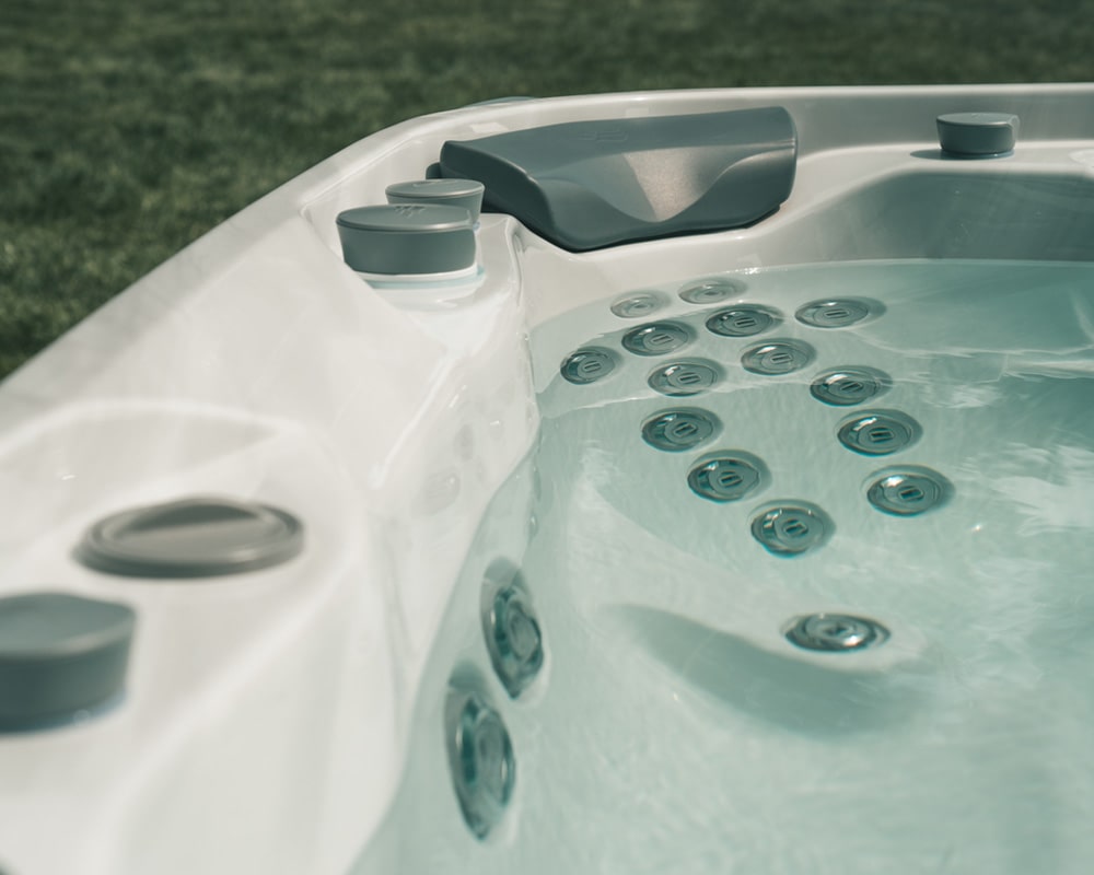 Close-up view of massage jets in a hot tub filled with water
